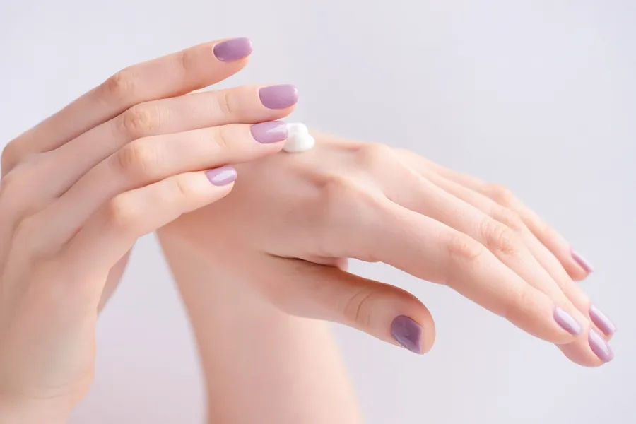 Teenage hands demonstrating proper patch test technique for hair removal cream safety